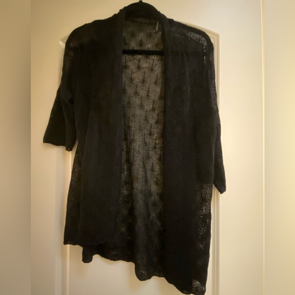 Eileen Fisher black crochet stretch wrap w/ mid length sleeves. Size Medium.